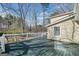 Spacious back deck featuring painted wood, white railings, and a serene view of the backyard at 444 Pineview Dr, Canton, GA 30114