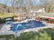 Aerial view of the backyard pool area with lounge seating, landscaping, and mature trees at 444 Pineview Dr, Canton, GA 30114