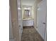 Bathroom featuring a white vanity, a mirror and neutral colored walls and carpeted flooring at 245 Kim Trl, Stockbridge, GA 30281