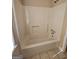 A standard bathtub with shower head, grab bar and shower caddy at 245 Kim Trl, Stockbridge, GA 30281