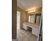 Bathroom with a vanity, a large mirror, and a shower/tub combo in the background at 245 Kim Trail, Stockbridge, GA 30281