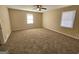 Spacious bedroom with neutral walls, carpeted flooring, and windows for natural light at 245 Kim Trl, Stockbridge, GA 30281