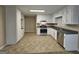 Spacious kitchen featuring stainless steel appliances, plenty of white cabinetry, and neutral walls at 245 Kim Trl, Stockbridge, GA 30281