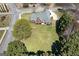 Expansive aerial view of charming brick home with large yard and mature trees at 1000 Maria Dr, Mcdonough, GA 30253