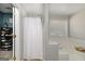 Bathroom featuring a tub, white shower curtain, and a window, offering a space to unwind at 1000 Maria Dr, Mcdonough, GA 30253