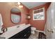 A full bathroom with an earth-tone color scheme, a tub and shower, and a modern black vanity at 1000 Maria Dr, Mcdonough, GA 30253