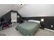 Bedroom with a black accent wall, a window for natural light, and a calming atmosphere at 1000 Maria Dr, Mcdonough, GA 30253