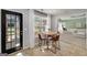 Cozy breakfast nook with natural light, seating a round wooden table and chairs, next to the door and overlooking the living room at 1000 Maria Dr, Mcdonough, GA 30253