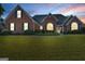 Attractive brick home with a well-kept lawn, beautiful landscaping, and welcoming curb appeal at 1000 Maria Dr, Mcdonough, GA 30253