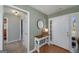 Bright entryway with wood floors, a decorative console table, and a view of the front door at 1000 Maria Dr, Mcdonough, GA 30253