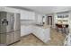 Beautiful kitchen featuring stainless steel appliances, white cabinetry, and a cozy breakfast nook for casual dining at 1000 Maria Dr, Mcdonough, GA 30253