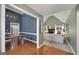 Open concept living area showcasing a fireplace, modern lighting, and adjacent dining space and kitchen at 1000 Maria Dr, Mcdonough, GA 30253