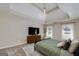 Spacious main bedroom with a chandelier, natural light and a TV area creates a relaxing retreat within the home at 1000 Maria Dr, Mcdonough, GA 30253