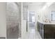 A luxurious bathroom featuring a tiled shower, double sinks, and stylish finishes at 14 Singleton Way, Peachtree City, GA 30269