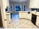 Bright kitchen featuring ample countertop space, white cabinets and modern appliances at 704 Euel Dr, Mcdonough, GA 30252