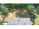 Aerial view displays a well-maintained roof and a private, fenced backyard with trees at 3216 Pheasant Dr, Decatur, GA 30034