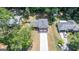 An aerial view of a charming red brick home with a long driveway and a two-car garage at 3216 Pheasant Dr, Decatur, GA 30034