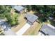 Aerial view of a traditional brick home featuring a two-car garage and a spacious driveway at 3216 Pheasant Dr, Decatur, GA 30034