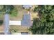 Aerial view shows the home's roof, surrounded by a large yard, mature trees and a fence at 3216 Pheasant Dr, Decatur, GA 30034