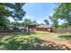 Large backyard showcasing the home's exterior, mature trees, and landscaping at 3216 Pheasant Dr, Decatur, GA 30034