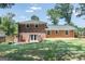 Well-maintained backyard featuring brick exterior, ample green space, and a patio area at 3216 Pheasant Dr, Decatur, GA 30034