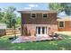 Brick home's backyard patio includes a basketball hoop and access through glass doors at 3216 Pheasant Dr, Decatur, GA 30034