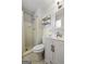 Bathroom with tile shower, toilet, and vanity with silver hardware at 3216 Pheasant Dr, Decatur, GA 30034