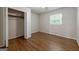 Bedroom with hardwood floors, closet, and window at 3216 Pheasant Dr, Decatur, GA 30034