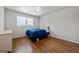 Bedroom with hardwood flooring, a ceiling fan, and a bed with blue comforter at 3216 Pheasant Dr, Decatur, GA 30034