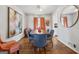 Formal dining room with hardwood floors, modern lighting, neutral walls and plenty of natural light at 3216 Pheasant Dr, Decatur, GA 30034