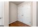 Entryway featuring hardwood flooring and a classic double door coat closet for storage solutions at 3216 Pheasant Dr, Decatur, GA 30034