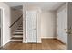 Entryway with gleaming hardwood floors, a staircase, and neutral-toned walls at 3216 Pheasant Dr, Decatur, GA 30034