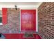 Close-up of a bold red double front door with a charming 'Home Sweet Home' welcome mat at 3216 Pheasant Dr, Decatur, GA 30034