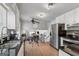 Modern kitchen with stainless steel appliances, white cabinets, and black granite countertops at 3216 Pheasant Dr, Decatur, GA 30034