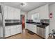 Spacious kitchen with stainless steel appliances, mosaic backsplash, and ample storage at 3216 Pheasant Dr, Decatur, GA 30034