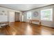 Well-lit living room with hardwood flooring, neutral walls, and large windows at 3216 Pheasant Dr, Decatur, GA 30034