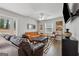 A stylish living room has a comfortable orange sofa, a black ottoman, and hardwood floors at 3216 Pheasant Dr, Decatur, GA 30034