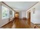 Bright living room featuring hardwood floors, white walls, and natural light from large windows at 3216 Pheasant Dr, Decatur, GA 30034