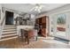 An open-concept living room features hardwood floors, an adjacent kitchen, and bright, natural light at 3216 Pheasant Dr, Decatur, GA 30034