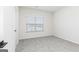 Carpeted bedroom with a window with blinds and white walls and door at 3201 Azteca Way, Dacula, GA 30019