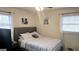 Serene bedroom featuring neutral tones, soft bedding, and ample natural light through the large windows at 5142 Rock Eagle Dr, Stone Mountain, GA 30083