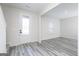 Bright entryway featuring stylish gray wood floors, white walls, and a frosted glass door at 3754 Saddle Bag Ct, Dacula, GA 30019