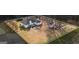 Aerial view of the property with a spacious backyard, patio, and additional shed at 3403 Bill Gardner Pkwy, Locust Grove, GA 30248