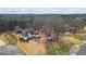 Aerial view of the back of the house, backyard and nearby trees at 3403 Bill Gardner Pkwy, Locust Grove, GA 30248