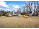 Large backyard showcasing a patio, outbuilding, and distinctive airplane, perfect for outdoor enjoyment at 3403 Bill Gardner Pkwy, Locust Grove, GA 30248