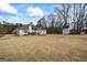 Large backyard with a shed and ample space, offering a serene outdoor environment at 3403 Bill Gardner Pkwy, Locust Grove, GA 30248
