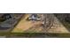 Expansive backyard featuring a seating area, detached garage, and well-defined property lines at 3403 Bill Gardner Pkwy, Locust Grove, GA 30248