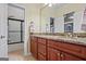 Bathroom with granite countertops, double vanity, and updated shower and toilet at 3403 Bill Gardner Pkwy, Locust Grove, GA 30248