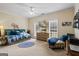 Comfortable bedroom features a large bed, tv, ceiling fan, and lots of space at 3403 Bill Gardner Pkwy, Locust Grove, GA 30248