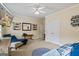 Comfortable bedroom features a large bed, tv, ceiling fan, and lots of space at 3403 Bill Gardner Pkwy, Locust Grove, GA 30248